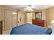 Spacious bedroom with a double bed and ample closet space at 1435 Mohawk Cir, Tavares, FL 32778