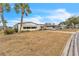 Single-wide manufactured home with carport and spacious yard at 1435 Mohawk Cir, Tavares, FL 32778