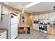 Bright kitchen with white cabinets and a breakfast bar at 1435 Mohawk Cir, Tavares, FL 32778