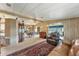 Living area with brown leather furniture and an oriental rug at 1435 Mohawk Cir, Tavares, FL 32778