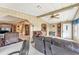 Open living room showcasing comfortable seating and access to other rooms at 1435 Mohawk Cir, Tavares, FL 32778