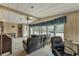 Relaxing living room with large windows and ample natural light at 1435 Mohawk Cir, Tavares, FL 32778