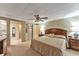 Spacious main bedroom with en-suite bathroom access at 1435 Mohawk Cir, Tavares, FL 32778