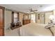 Main bedroom with a dresser and large bed at 1435 Mohawk Cir, Tavares, FL 32778