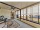 Bright sunroom featuring window blinds at 1435 Mohawk Cir, Tavares, FL 32778