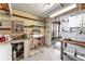 Workshop area with shelving, workbench, and exterior access at 1435 Mohawk Cir, Tavares, FL 32778