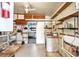 Workshop with workbench, storage shelves, and a sink at 1435 Mohawk Cir, Tavares, FL 32778