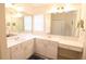 Spacious bathroom with double sinks, large mirror, and ample storage at 1443 Greenville Way, The Villages, FL 32162