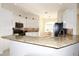 Modern kitchen featuring granite countertops and stainless steel appliances at 1443 Greenville Way, The Villages, FL 32162