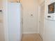 Convenient laundry room with built-in storage and a utility sink at 1443 Greenville Way, The Villages, FL 32162