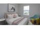 Well-lit bedroom with a bed and an accent chair at 16436 Hamlin View St, Winter Garden, FL 34787