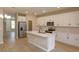 Modern kitchen with stainless steel appliances and white cabinets at 16436 Hamlin View St, Winter Garden, FL 34787