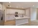 Modern kitchen with white cabinets, quartz countertops, and island at 16436 Hamlin View St, Winter Garden, FL 34787