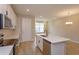 Modern kitchen with white cabinets, quartz countertops, and island at 16436 Hamlin View St, Winter Garden, FL 34787