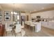 Modern kitchen with white cabinets, quartz countertops, and island at 16436 Hamlin View St, Winter Garden, FL 34787