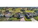 Aerial view of house and surrounding golf course at 1730 Augustine Dr, The Villages, FL 32159