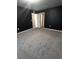 Bright bedroom with neutral walls and carpeting, showing access to other rooms at 209 Hyacinth Ct, Kissimmee, FL 34759