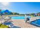 Relaxing community pool with patio furniture and a fun water feature for  at 209 Hyacinth Ct, Kissimmee, FL 34759