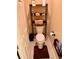 Small bathroom with toilet and shelving unit at 2372 Arbordale Ave, The Villages, FL 32162