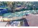 Backyard oasis with patio, grill, and pond view at 316 Amanda Ln, Leesburg, FL 34748