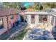 Backyard with patio table and access to pool area at 316 Amanda Ln, Leesburg, FL 34748
