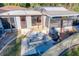 Backyard with patio table, grill, and access to pool area at 316 Amanda Ln, Leesburg, FL 34748