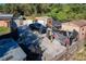 Large backyard with multiple storage sheds and vehicles at 316 Amanda Ln, Leesburg, FL 34748