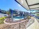 Landscaped backyard with screened pool and patio at 316 Amanda Ln, Leesburg, FL 34748