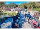 Large backyard with multiple storage sheds and vehicles at 316 Amanda Ln, Leesburg, FL 34748