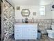 Bathroom with shower, vanity, and geometric tile at 316 Amanda Ln, Leesburg, FL 34748