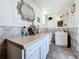 Bathroom with double vanity and geometric tile at 316 Amanda Ln, Leesburg, FL 34748
