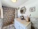 Bathroom with shower, vanity, and geometric tile at 316 Amanda Ln, Leesburg, FL 34748