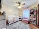 Charming Bedroom with crib, changing table, and plenty of storage at 316 Amanda Ln, Leesburg, FL 34748