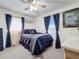 Bedroom with full bed, dresser, and ceiling fan at 316 Amanda Ln, Leesburg, FL 34748
