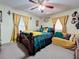 Cozy bedroom with a double bed and yellow and teal decor at 316 Amanda Ln, Leesburg, FL 34748