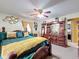 Spacious bedroom with a wooden bed frame and gold accents at 316 Amanda Ln, Leesburg, FL 34748