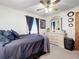 Bedroom with queen bed, dresser, and ceiling fan at 316 Amanda Ln, Leesburg, FL 34748