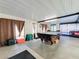 Game room with pool table and seating area at 316 Amanda Ln, Leesburg, FL 34748