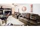 Open Gathering room with modern furniture, including leather recliners at 316 Amanda Ln, Leesburg, FL 34748