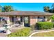 Brick facade home with decorative accents, a fountain, and well-manicured landscaping at 316 Amanda Ln, Leesburg, FL 34748