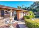 Front view of the home, showcasing a brick walkway and a decorative fountain at 316 Amanda Ln, Leesburg, FL 34748