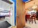 Open doorway view of kitchen and game room beyond at 316 Amanda Ln, Leesburg, FL 34748