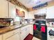 Clean kitchen, equipped with stainless steel appliances and wood cabinets at 316 Amanda Ln, Leesburg, FL 34748