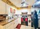 Well-lit kitchen with stainless steel appliances and a lovely backsplash at 316 Amanda Ln, Leesburg, FL 34748