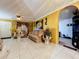 Living room with tiled floors, neutral-toned furniture, and an open floor plan at 316 Amanda Ln, Leesburg, FL 34748