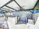 Outdoor kitchen area with ceiling fans and granite countertop at 316 Amanda Ln, Leesburg, FL 34748