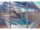 Relaxing screened-in pool area with ample space at 316 Amanda Ln, Leesburg, FL 34748