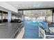 Inviting pool area with spa, screened enclosure, and outdoor kitchen at 316 Amanda Ln, Leesburg, FL 34748