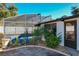 Landscaped pool area with a cabana and privacy fence at 316 Amanda Ln, Leesburg, FL 34748