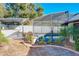 Outdoor kitchen and pool with covered patio area at 316 Amanda Ln, Leesburg, FL 34748